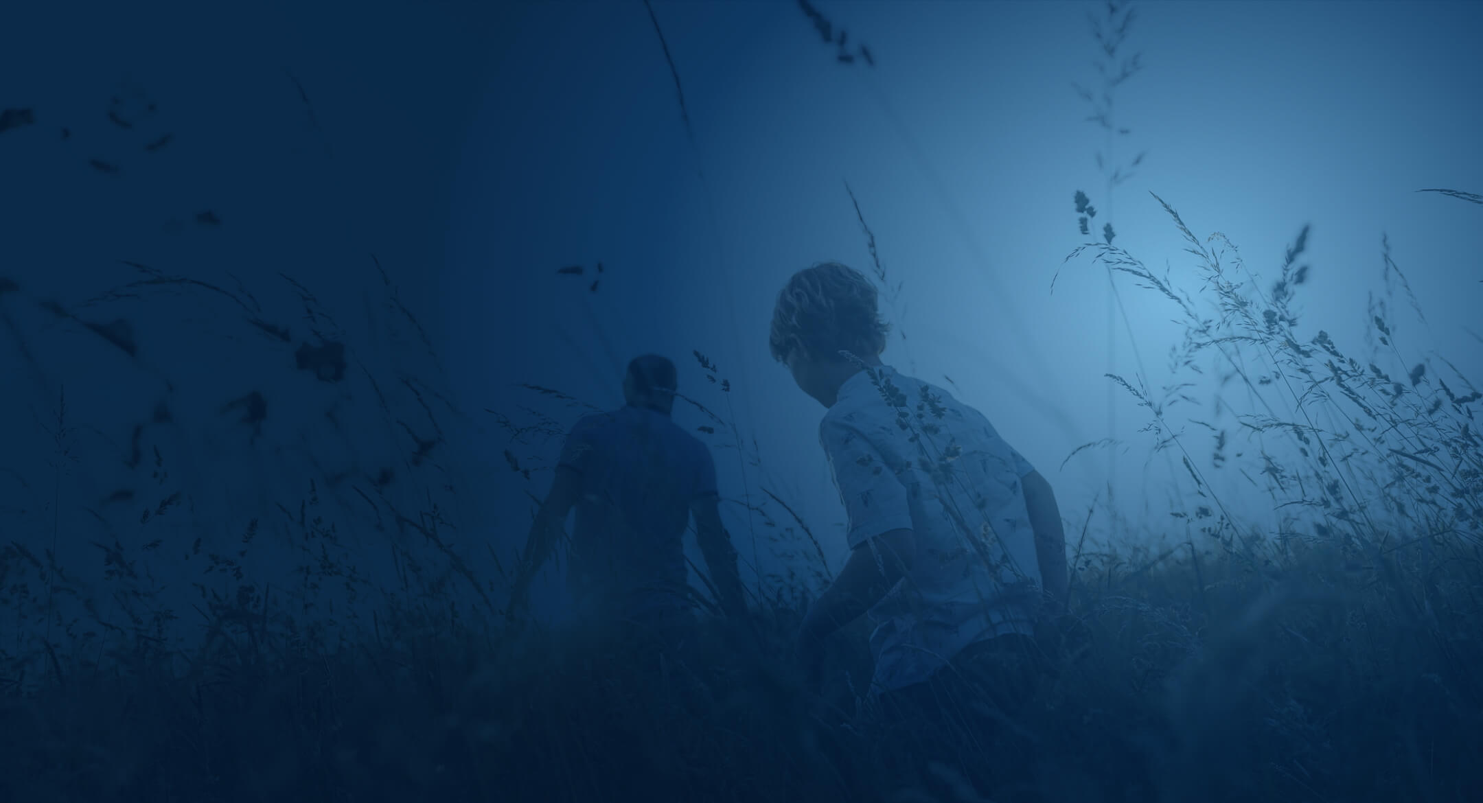Backs of boy and father walking in nature overlayed with blue background.